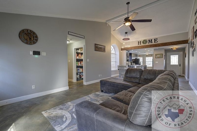 living room with ceiling fan and vaulted ceiling