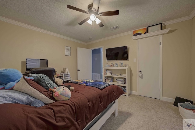 bedroom featuring light colored carpet, a textured ceiling, ceiling fan, and ornamental molding