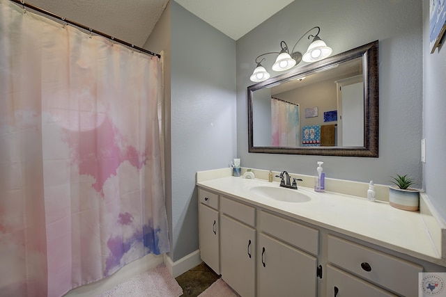 bathroom featuring tile patterned floors, vanity, and walk in shower