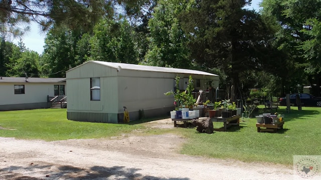 exterior space with a yard