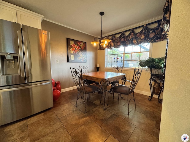 3905 Colorado St, Texarkana, TX 75503 - dining area featuring ornamental molding, baseboards, and dark tile patterned flooring