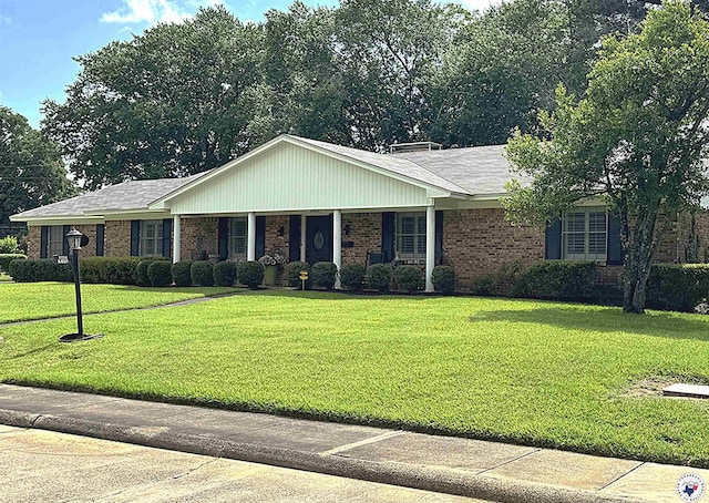 3905 Colorado St, Texarkana, TX 75503 - ranch-style house with brick siding and a front yard