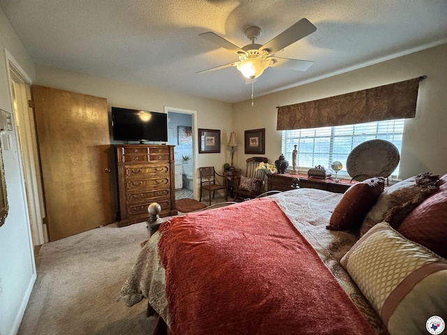 3905 Colorado St, Texarkana, TX 75503 - carpeted bedroom featuring a ceiling fan and ensuite bath