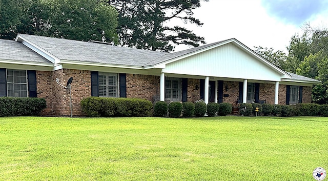 3905 Colorado St, Texarkana, TX 75503 - single story home with a front yard, brick siding, and covered porch