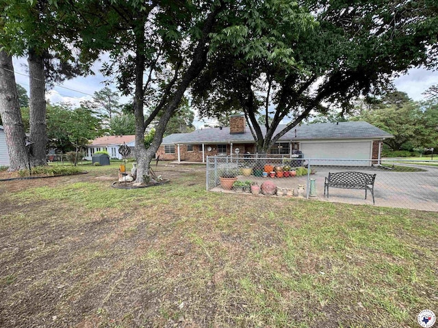 3905 Colorado St, Texarkana, TX 75503 - view of yard featuring a garage and driveway
