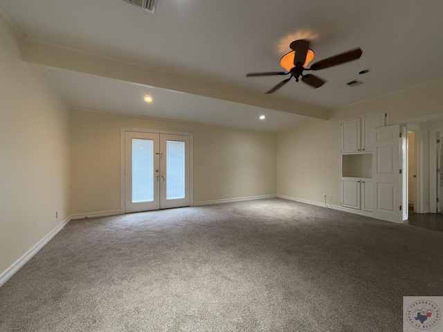 unfurnished living room featuring ceiling fan, french doors, beamed ceiling, and carpet flooring