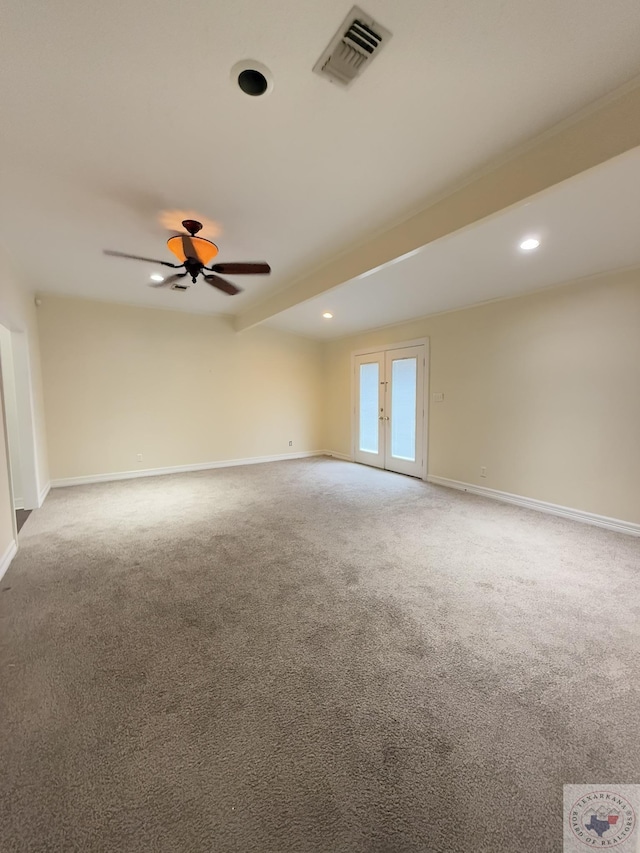 unfurnished room featuring ceiling fan, french doors, beamed ceiling, and carpet flooring