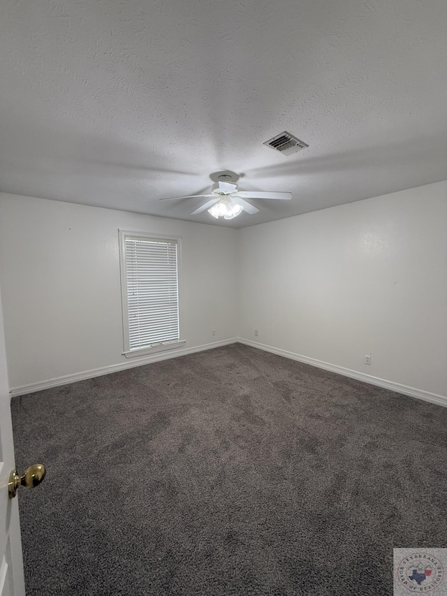 carpeted empty room with a textured ceiling and ceiling fan