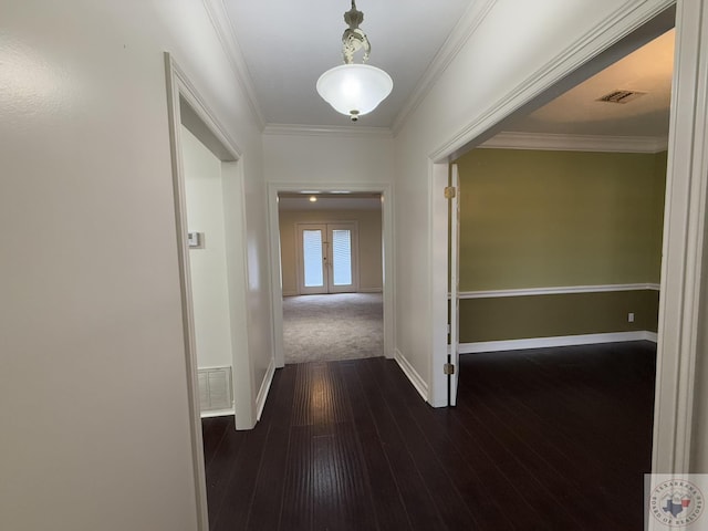 hall with crown molding, dark wood-type flooring, and french doors