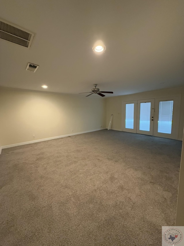 spare room featuring ceiling fan and carpet flooring