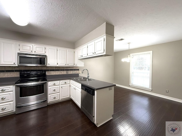 kitchen featuring sink, white cabinets, and appliances with stainless steel finishes