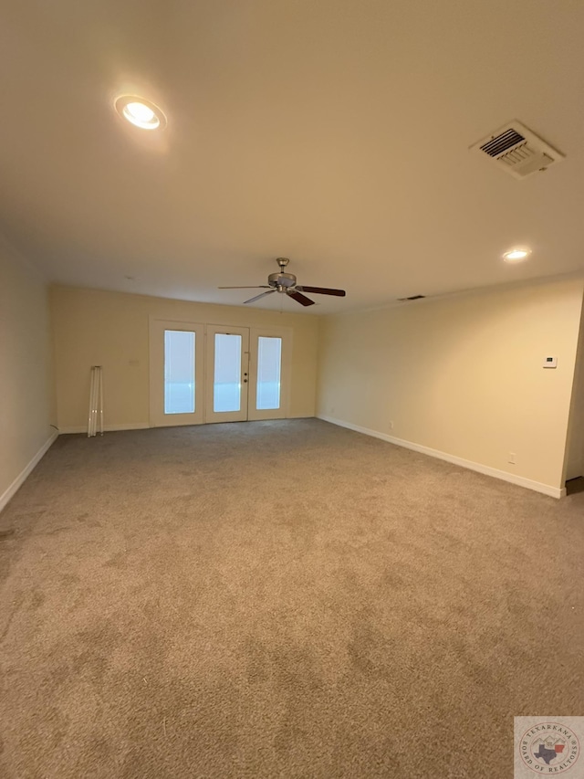 empty room featuring carpet flooring and ceiling fan