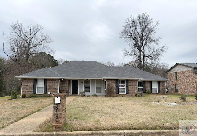 ranch-style house featuring a front lawn