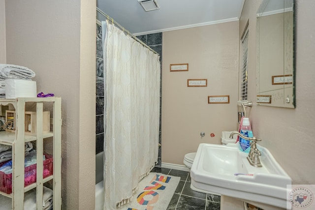 full bathroom with tile patterned floors, shower / bath combination with curtain, sink, toilet, and crown molding