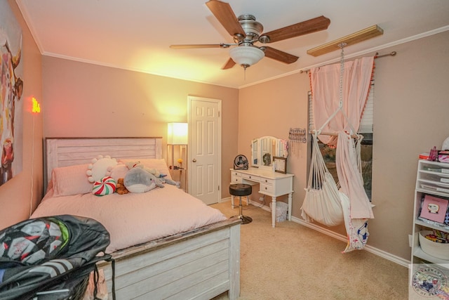 carpeted bedroom featuring ceiling fan and ornamental molding