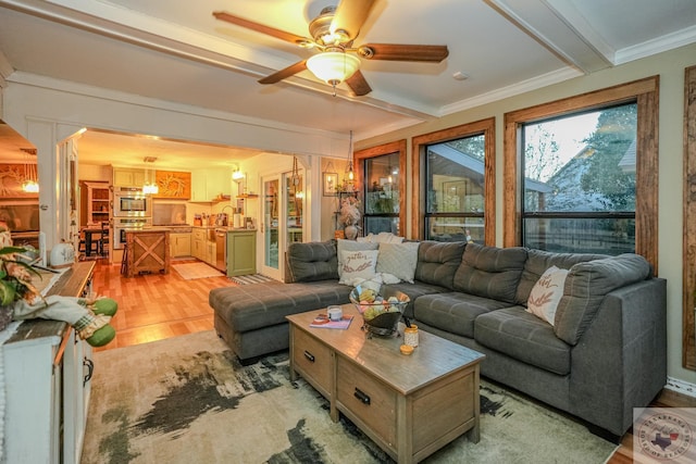 living room featuring light hardwood / wood-style floors, sink, ornamental molding, and ceiling fan