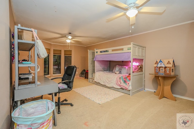 carpeted bedroom featuring ceiling fan and ornamental molding