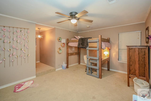 bedroom featuring ceiling fan, crown molding, and light carpet