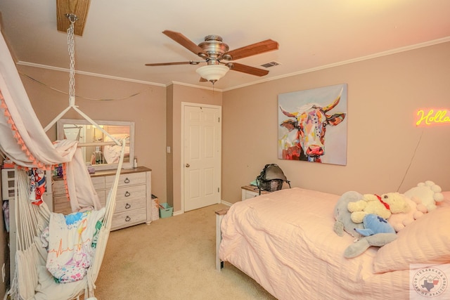 bedroom with ceiling fan, crown molding, and carpet flooring