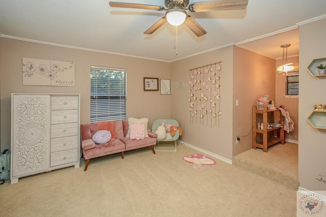 living area featuring ceiling fan, light colored carpet, and ornamental molding