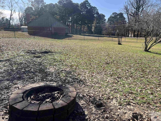 view of yard featuring a fire pit