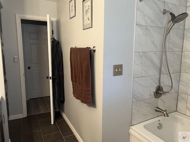 bathroom with tile patterned floors and tiled shower / bath