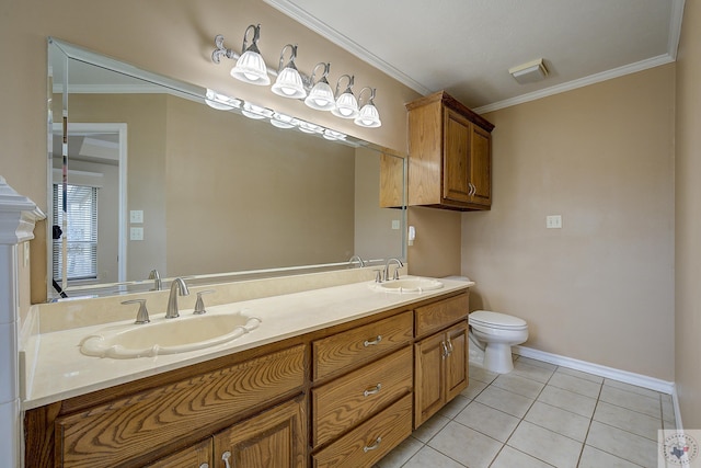 bathroom with crown molding, vanity, tile patterned floors, and toilet