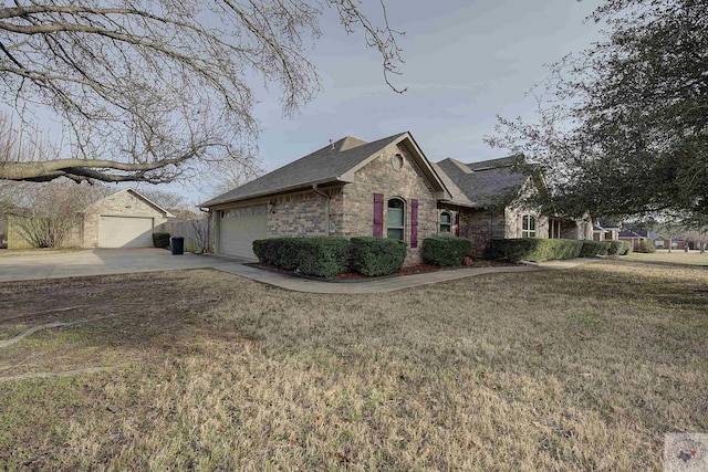 view of side of home featuring a yard and a garage