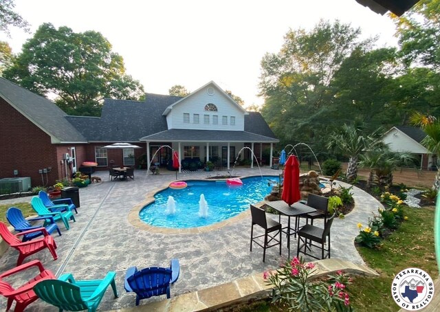 19 Hidden Valley Rd, Texarkana, TX 75501 - outdoor pool featuring a patio area, cooling unit, and a bar