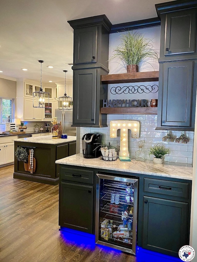 19 Hidden Valley Rd, Texarkana, TX 75501 - bar area with beverage cooler, decorative backsplash, dark wood-style floors, freestanding refrigerator, and recessed lighting