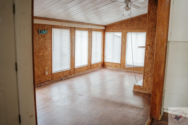 unfurnished sunroom with ceiling fan and vaulted ceiling