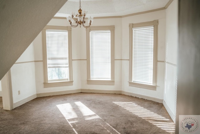 unfurnished dining area with a textured ceiling, crown molding, light carpet, and an inviting chandelier