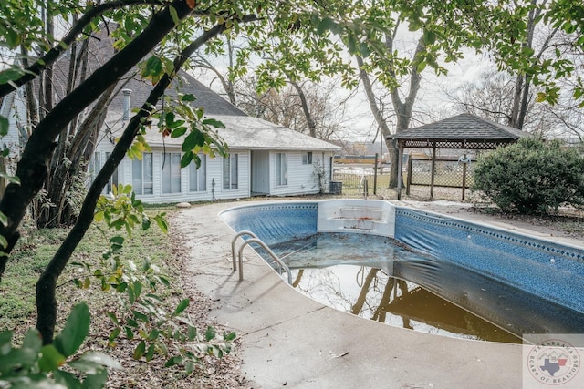 view of swimming pool featuring a gazebo