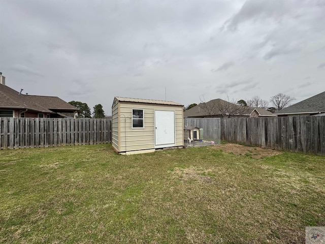 view of shed with a fenced backyard