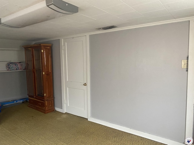 203 Patterson St, Naples, TX 75568 - unfurnished bedroom with carpet, baseboards, and crown molding