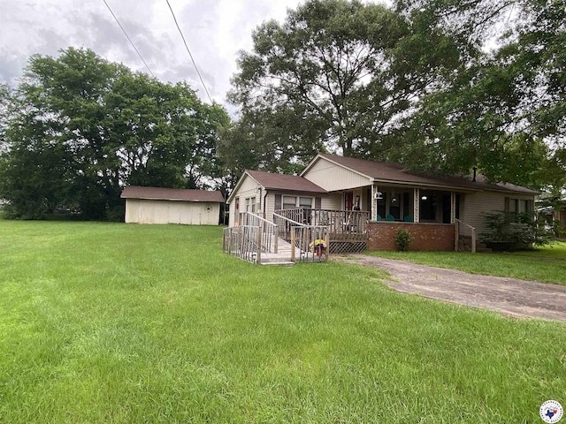 203 Patterson St, Naples, TX 75568 - view of front of home with a porch and a front lawn