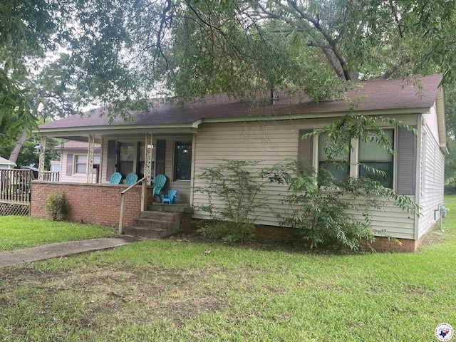 203 Patterson St, Naples, TX 75568 - single story home featuring a porch and a front yard