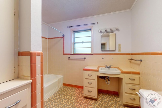 bathroom featuring sink, crown molding, shower / tub combination, and tile walls