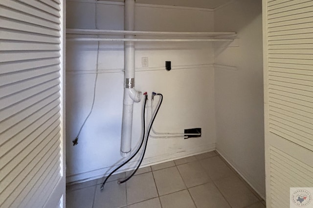 laundry room featuring tile patterned flooring