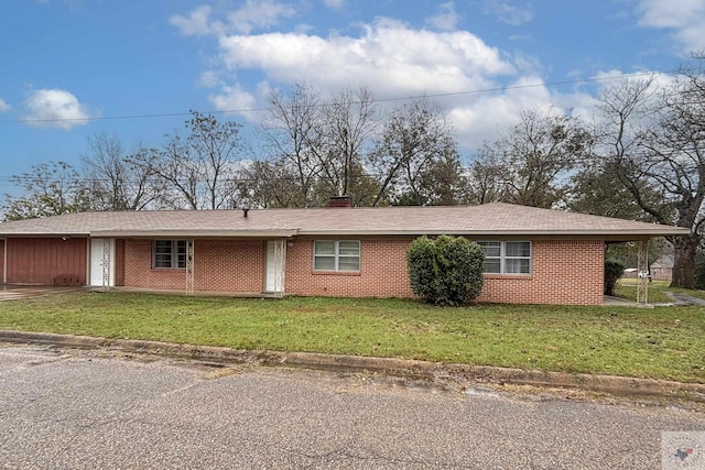 exterior space featuring a front yard and a carport