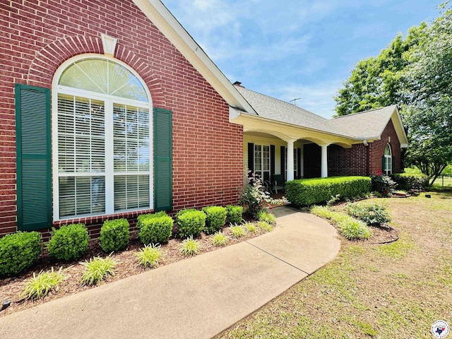 80 Tommy Hines Ln, Texarkana, TX 75501 - view of side of home featuring brick siding and a shingled roof