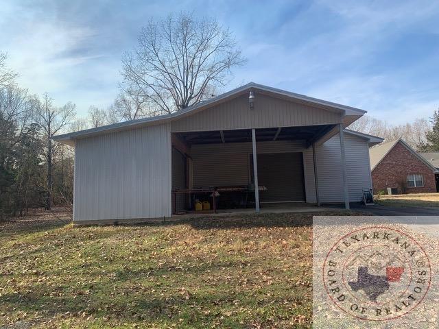 view of outbuilding featuring a yard