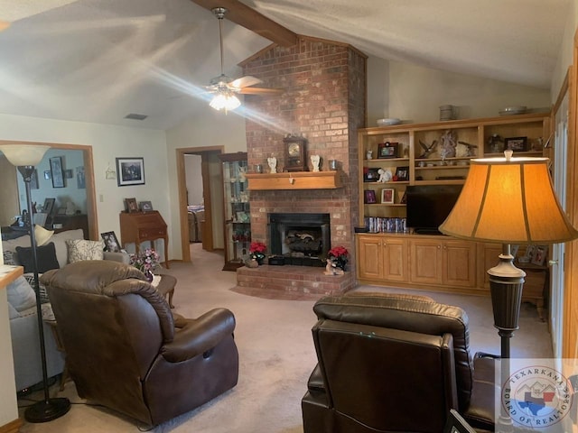 carpeted living room featuring ceiling fan, lofted ceiling with beams, and a brick fireplace