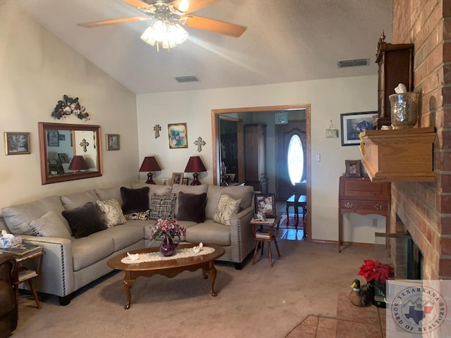 living room featuring a brick fireplace, light colored carpet, and ceiling fan