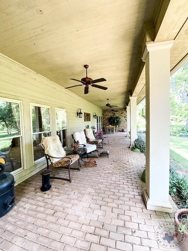 view of patio / terrace featuring ceiling fan