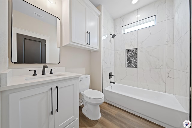 8405 Mandarin Cv, Texarkana, TX 75503 - bathroom featuring wood finished floors, toilet, shower / bath combination, vanity, and visible vents
