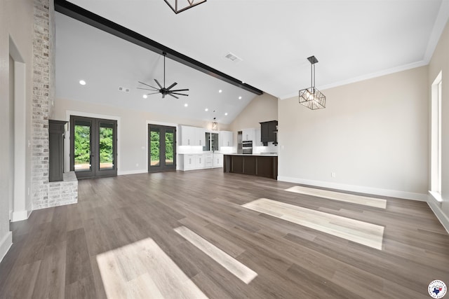 8405 Mandarin Cv, Texarkana, TX 75503 - unfurnished living room with recessed lighting, ceiling fan with notable chandelier, baseboards, visible vents, and high vaulted ceiling