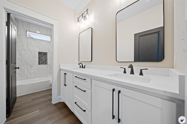 8405 Mandarin Cv, Texarkana, TX 75503 - full bath with wood finished floors, toilet, double vanity, and a sink