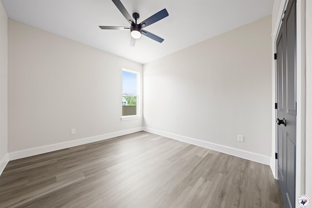 8405 Mandarin Cv, Texarkana, TX 75503 - unfurnished bedroom with wood finished floors, a ceiling fan, and baseboards