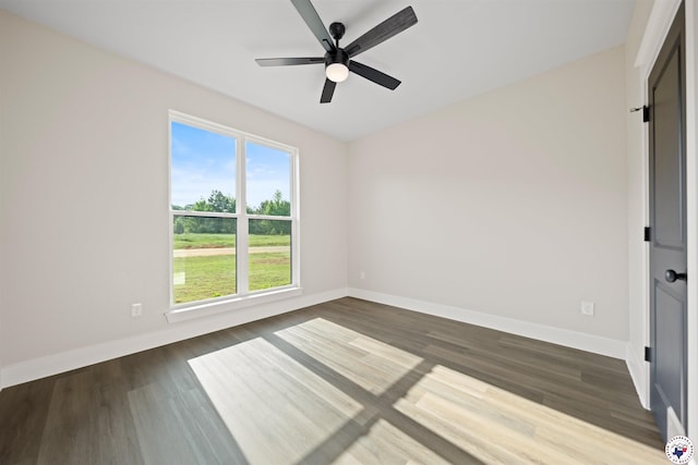 8405 Mandarin Cv, Texarkana, TX 75503 - interior space featuring dark wood-style floors, a ceiling fan, and baseboards